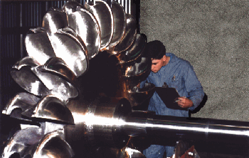 Canyon Hydro technician inspecting Pelton wheel