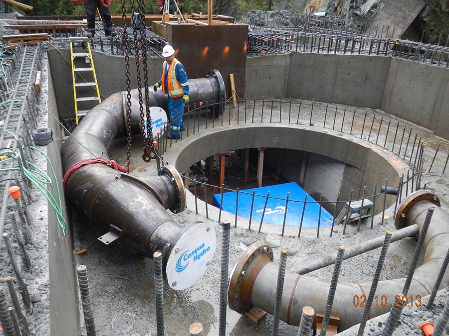 Turbine distributor piping sections being placed.